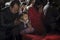 Crowded people kneel down and praying in temple