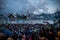 Crowded people waiting National Day Fireworks Display in rain at waterfront of Victoria Harbour of Hong Kong