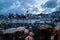 Crowded people waiting National Day Fireworks Display in rain at waterfront of Victoria Harbour of Hong Kong