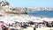 Crowded sandy beach in Cascais near Lisbon, Portugal