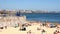 Crowded sandy beach in Cascais near Lisbon, Portugal - 4K