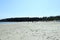 A crowded sandy beach full of locals and tourists on a beautiful sunny day in Tribune Bay, on Hornby island, British Columbia, Can