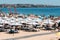 Crowded sandy Conceicao beach in Cascais near Lisbon, Portugal during the summer