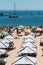 Crowded sandy Conceicao beach in Cascais near Lisbon, Portugal during the summer