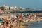 Crowded sandy Tamariz beach in Estoril near Lisbon, Portugal during the summer