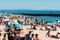 Crowded sandy Tamariz beach in Estoril near Lisbon, Portugal during the summer