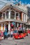 Crowded street of people and a red motorcycle taxi in the middle of a Holy Week Celebration Holiday afternoon