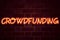 Crowdfunding neon sign on brick wall background. Fluorescent Neon tube Sign on brickwork Business concept for Business Fundraising