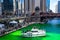 Crowds gather along Wacker Drive, the riverwalk and on a boat to celebrate St. Patrick`s Day in Chicago
