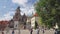 Crowds of international tourists passing by in courtyard of Wawel Royal Castle