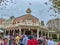 The crowds of people in front of Caseys Corner restaurant at Disney World during the Christmas holiday season