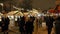 Crowds of people walk at the new year`s Christmas market in the city center along the stalls with Souvenirs and street