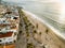 Crowds of people walking on boardwalk seen from aerial view of el Malecon Puerto Vallarta Mexico