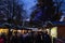 Crowds of Shoppers at a Christmas Market in Early Evening.