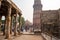 Crowds of tourists enjoy exploring the Qutub Minar ancient complex and ruins