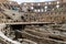 Crowds of tourists line the walls of the Colosseum in Rome above