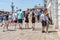 Crowds of tourists strolling on the cobblestone alley near Grand Canal in Venice