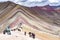 Crowds of tourists on the Vinicuna `rainbow mountain`. Cordillera Vilcanota, Cusco, Peru