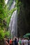 Crowds under waterfall in Wulong National Park