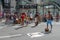 Crowds walking and looking at performances in Paulista Avenue on Sunday afternoon