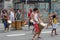 Crowds walking and looking at performances in Paulista Avenue on Sunday afternoon