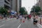 Crowds walking and looking at performances in Paulista Avenue on Sunday afternoon