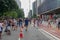 Crowds walking and looking at performances in Paulista Avenue on Sunday afternoon