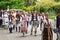 A crowed of artisans marches in the park during the artisan festival