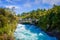 A crown of people over the bridge enjoying the view of the powerful Huka Falls on the Waikato River near Taupo North