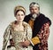 Crown, queen and king in costume isolated on studio background for medieval, renaissance and England culture. Headshot