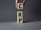 CRP - C-Reactive Protein Test symbol. Wooden cubes with word CRP. Doctor hand. Beautiful grey background. Medical and C-Reactive