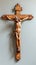 Crucified Jesus Christ, carved in wood. Sculpture of Christ on cross. Crucifix of the Savior. Concept of Easter