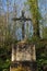 Crucifix in a forest near Paris in France, Europe