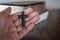 The crucifix lay on the palm of the hand,Bible background And close-up images of praying for the blessing of Jesus, God. Faith in