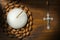 Crucifix with Rosary Bead and Votive Candle