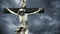 Crucifixion. Christian cross with crucified Jesus Christ statue over dark clouds time lapse.