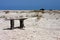 Crude bench on sandy beach