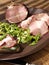Crude, dried gammon ham with sandwich, salad on plate
