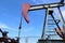 Crude oil jack pump under blue sky in europe