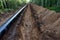 Crude oil and Natural gas pipeline construction work in forest area.  Installation the Petrochemical Pipe. Construction the