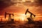 Crude oil Pumpjack on oilfield on sunset.