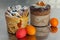 Cruffin and brown Easter cake decorated with chocolate, almond flakes and dried apricots on kitchen table among easter eggs