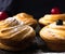 Cruffin - Buns from yeast dough. Dark graunge background. Mystical light. cinnamon craffin cinnabon mix of croissant and muffin