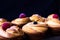 Cruffins - Buns from yeast dough. Dark background. Mystical light. cinnamon craffin cinnabon mix of croissant and muffin