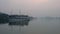 Cruise Boat floating in Ha Long Bay at dusk, North East Vietnam