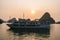 Cruise boat at sunset Halong bay