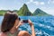 Cruise boat tourist taking mobile phone pictures of Deux pitons peaks, St-Lucia, Caribbean. The Gros and Petit Piton, world