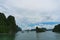 Cruise boats against spectacular Halong Bay landscape