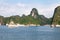 Cruise boats sailing among the karst formations in Halong Bay, Vietnam, in the gulf of Tonkin