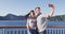 Cruise couple tourists taking selfie on New Zealand travel. People traveling on ferry boat Marlborough sounds taking